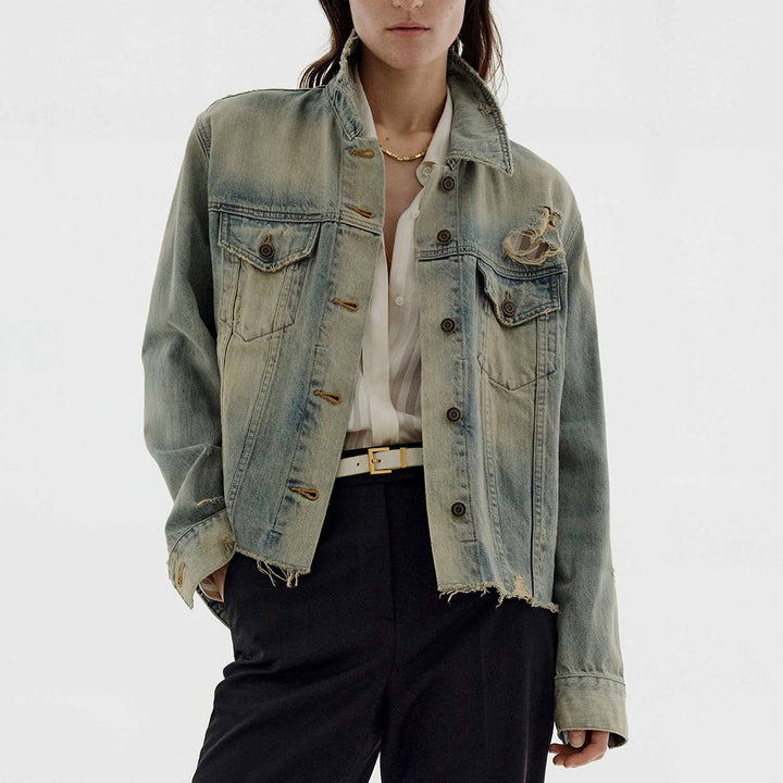 Women’s oversized destroyed denim jacket with raw hem, patch chest pockets, and vintage wash Mune Fashion