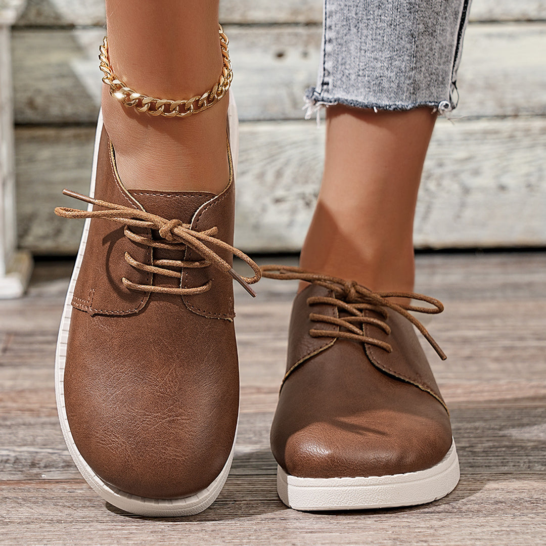 Women's lace-up sneakers made of synthetic leather with a cushioned comfort footbed and light profile sole Mune Fashion