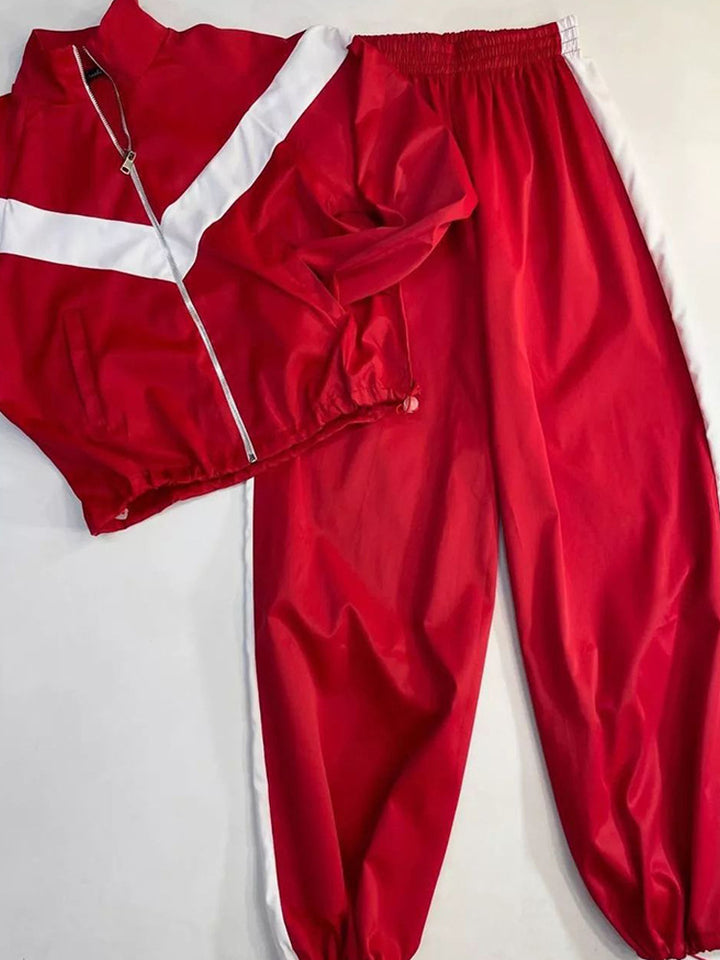 Women's satin track set with stand-up collar, chevron stripes and drawstring Mune Fashion