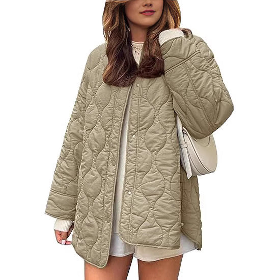 Women's quilted jacket in oversized design with curved quilting and side slit Mune Fashion