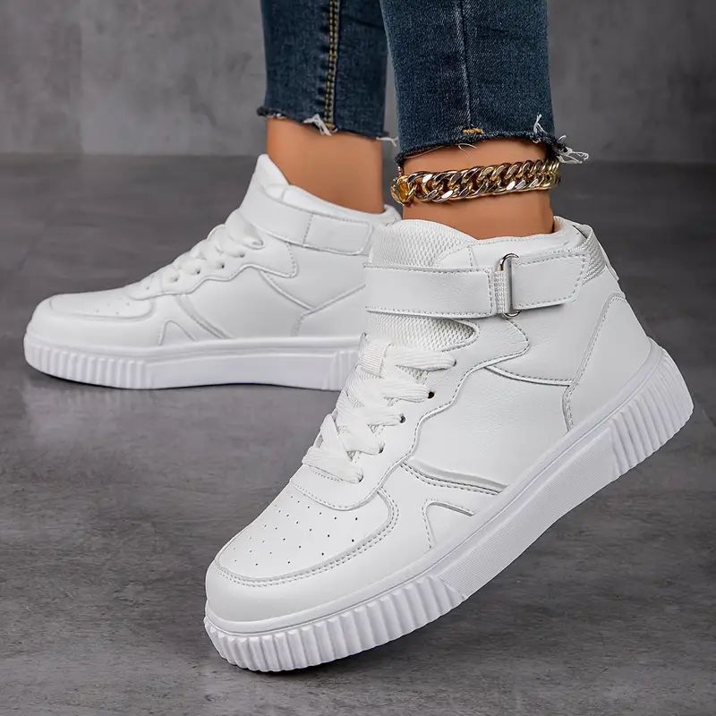 Women’s ankle-high polyurethane leather casual shoe with Velcro cuff, perforated toe cap, and textured rubber sole Mune Fashion