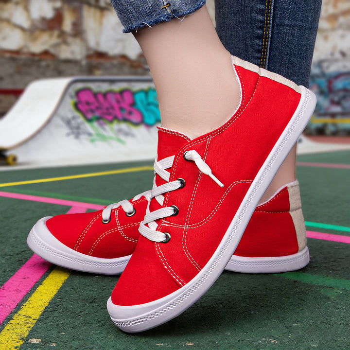 Women’s classic canvas low-top sneakers with reinforced rubber sole, metal eyelets, and padded heel collar Mune Fashion