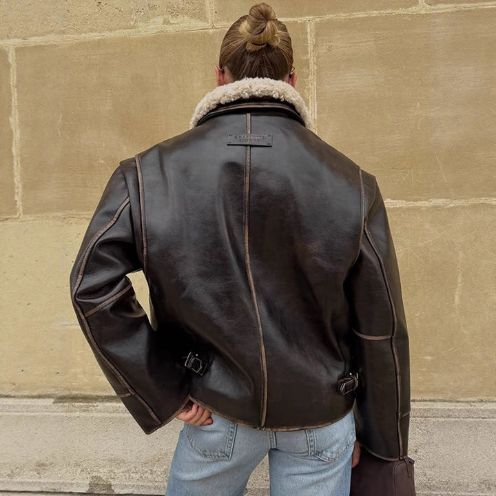 Women Short Cut Leather Imitation Bomber Jacket with Voluminous Teddy Shawl Collar and Distinctive Decorative Seams Mune Fashion