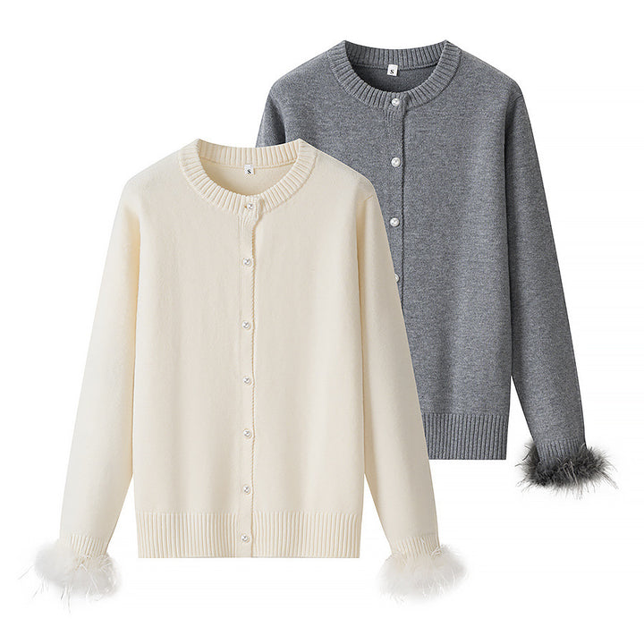 Women’s knit cardigan with pearl buttons and feather-trimmed sleeve cuffs Mune Fashion