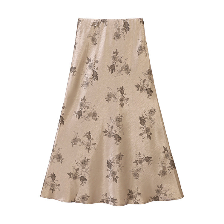 Women's high-waisted A-line midi skirt in jacquard-like satin with floral relief print.