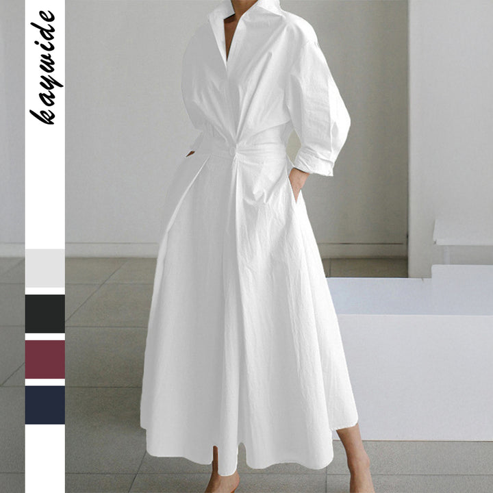 Women's tailored shirt dress with boxy collar, mid-length sleeves, side pockets, and flared pleated skirt Mune Fashion