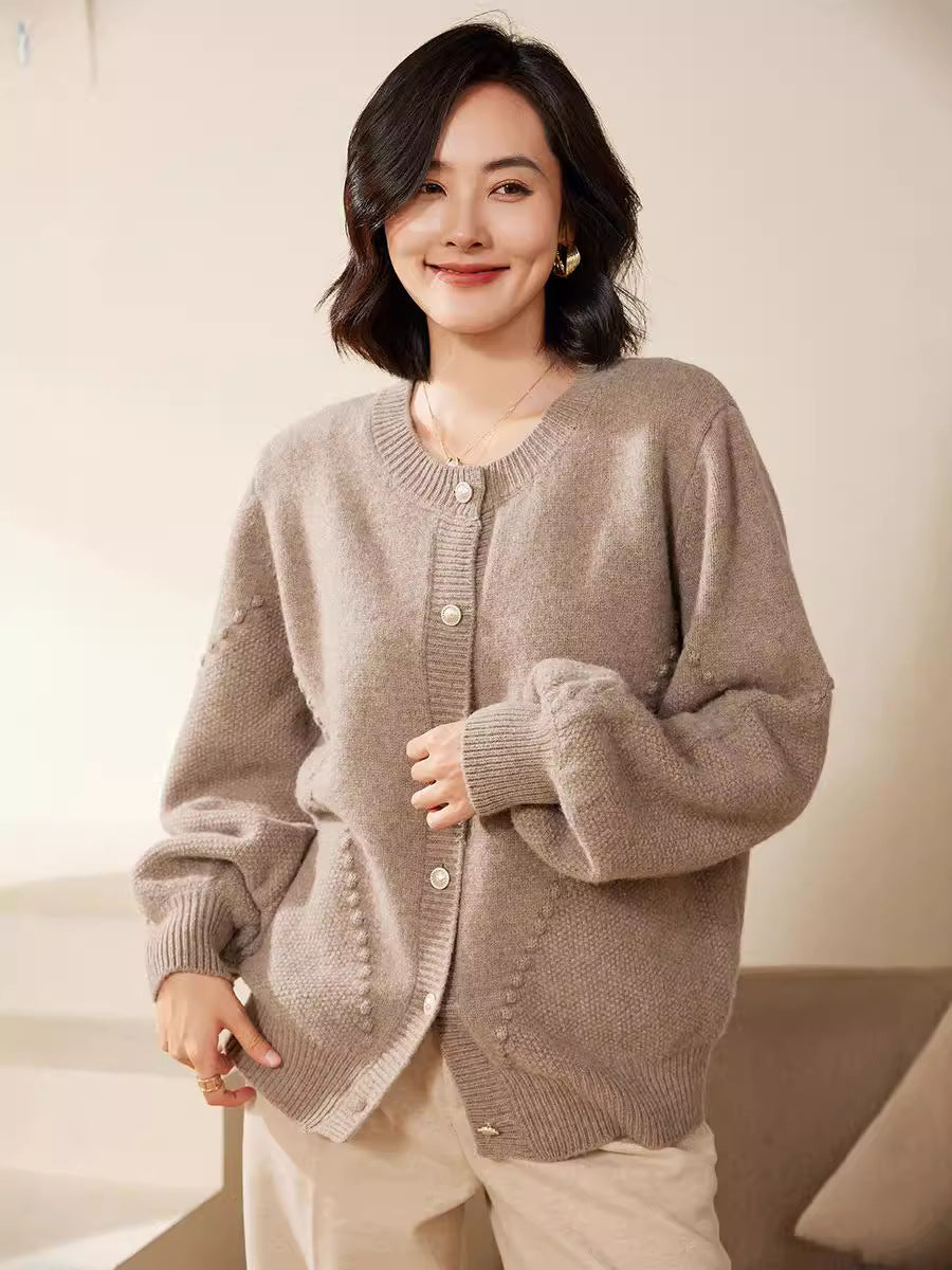 Women's knitted cardigan with textured pattern, balloon sleeves and pearly button placket Mune Fashion