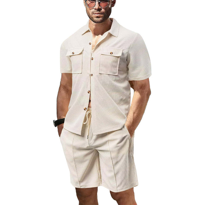Men's modern short-sleeve shirt set in resort style with patch pockets, open lapel collar, and drawstring Bermuda shorts made of textured jersey Mune Fashion