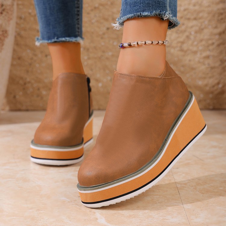 Women's Mune Fashion ankle boot with wedge heel, side zipper, and padded comfort insole