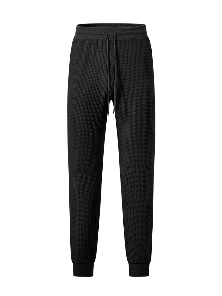 Men's fine-structured jersey lounge pants tapered cut with drawstring waistband and ribbed leg openings Mune Fashion