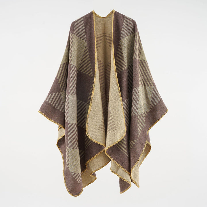Women’s cape poncho made of wool blend with geometric striped jacquard and open edge seam Mune Fashion