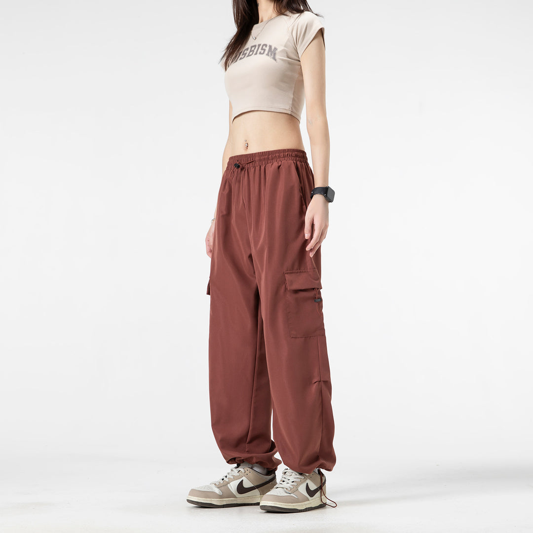 Men's wide technical cargo pants with drawstring waistband, multiple pockets and corded closure Drune