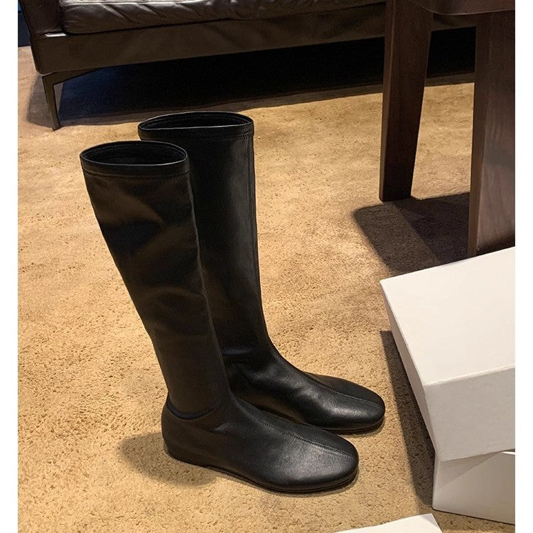Women’s leather knee-high boots with a slim silhouette and flat heel Mune Fashion