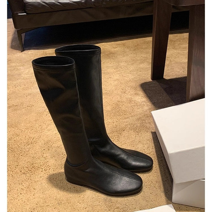 Women’s leather knee-high boots with a slim silhouette and flat heel Mune Fashion
