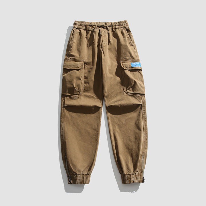 Herren Konisch geschnittene Utility-Cargo-Jogginghose mit Tunnelzugbund, Klapptaschen und Knöchelreißverschlüssen Mune Fashion