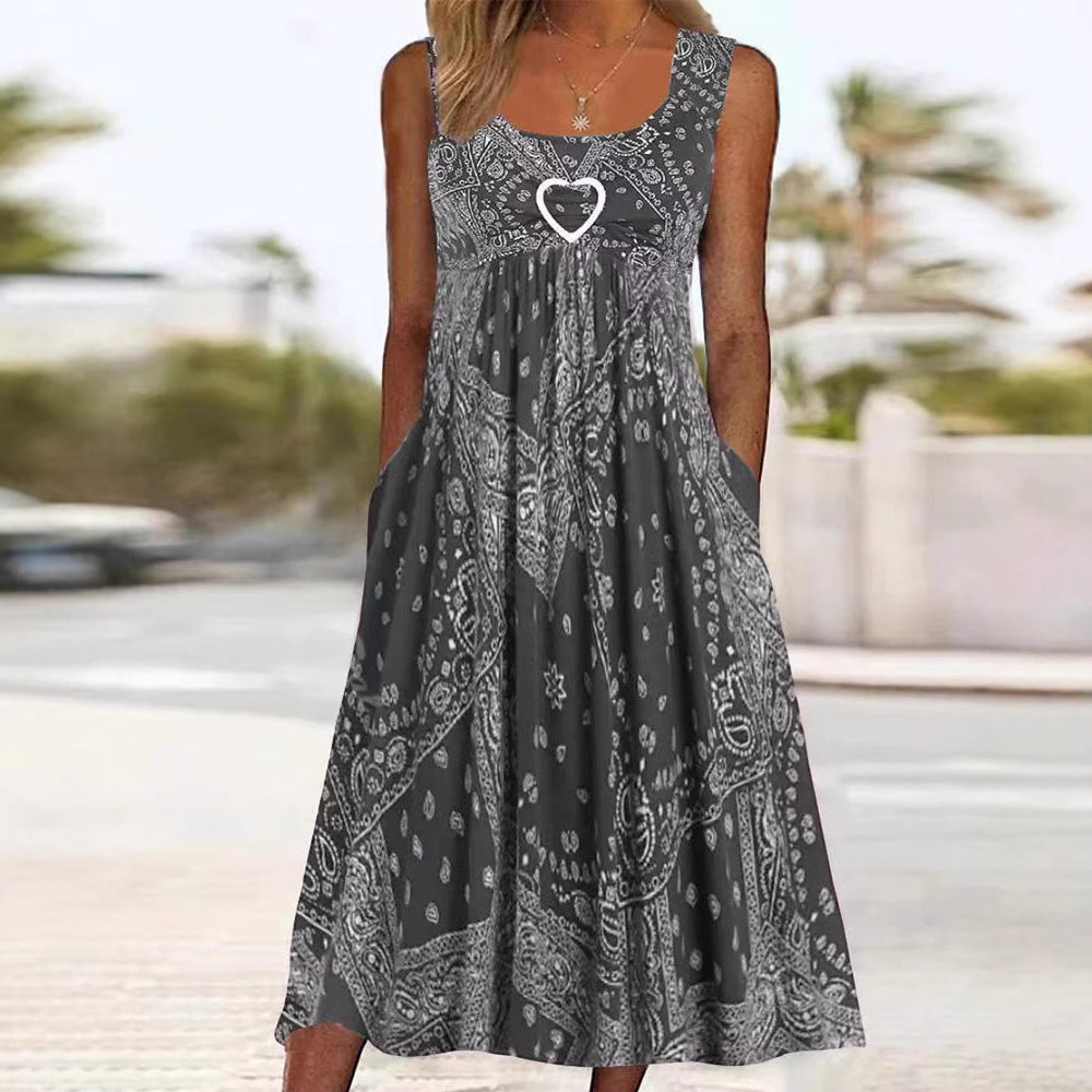 Women's airy maxi dress with paisley bandana print, gathered empire waist and practical side pockets Mune Fashion