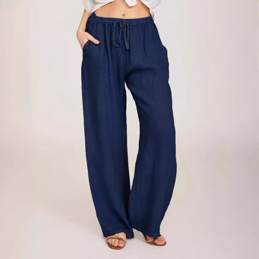 Women's airy palazzo pants with drawstring waistband, elastic waist finish, and side pockets Mune Fashion