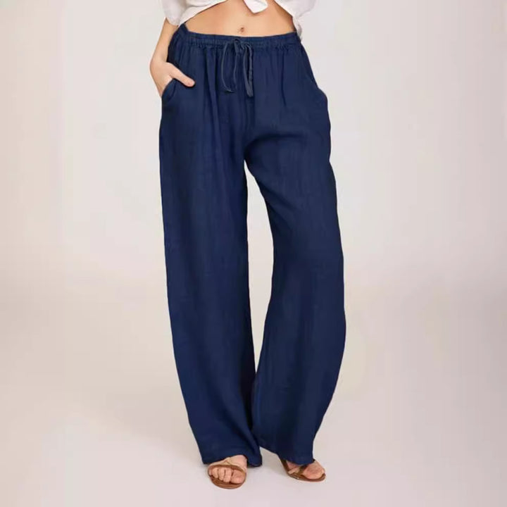 Women's airy palazzo pants with drawstring waistband, elastic waist finish, and side pockets Mune Fashion