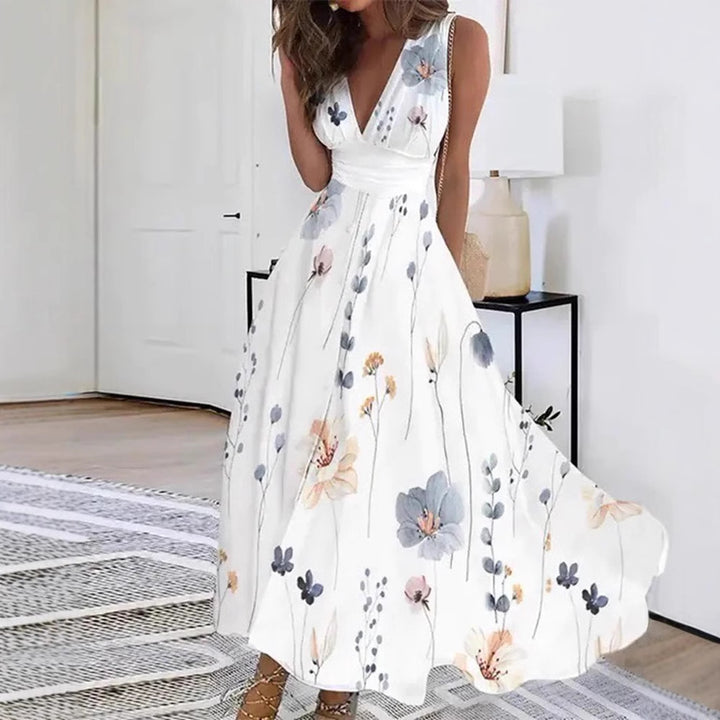 Women's flared midi dress with deep V-neck, empire waist and delicate floral print Mune Fashion