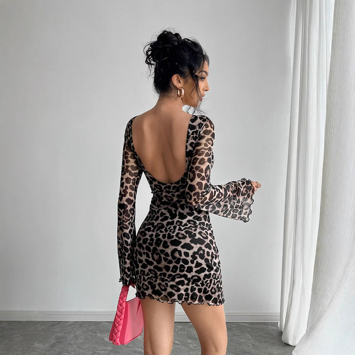 Women's form-fitting transparent mesh mini dress with leopard print, boat neckline, and wavy hem Mune Fashion