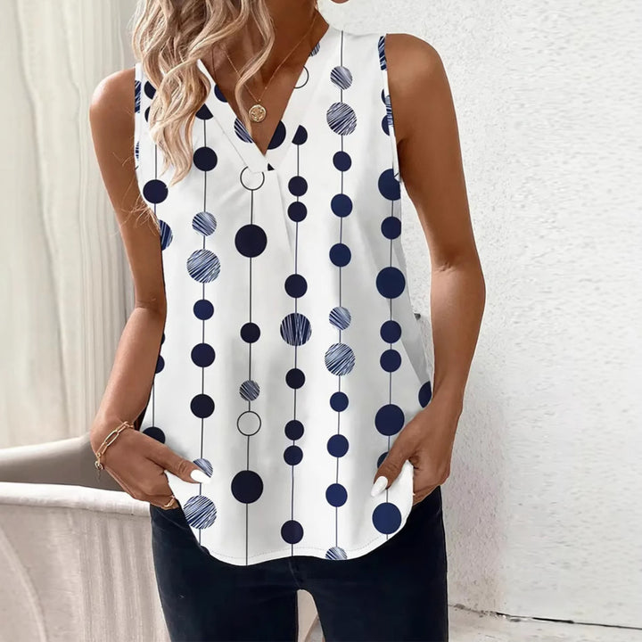 Women's V-neck blouse top with vertical polka dot pattern and subtle center seam Mune Fashion