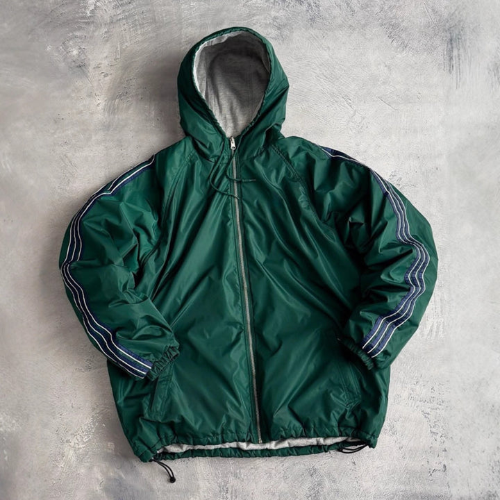 Unisex non-fitted windbreaker with hood padded fleece lining drawstring hem and decorative stripes on sleeves Mune Fashion