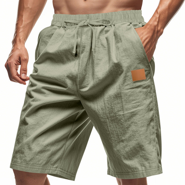 Men's lightweight casual Bermuda shorts with elastic waistband, drawstring and discreet leather application Mune Fashion