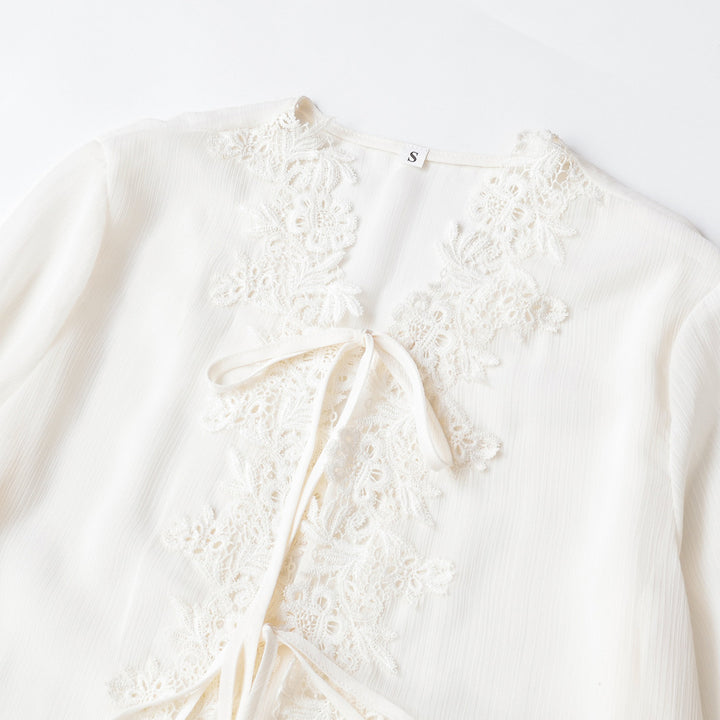 Ladies tunic blouse with lace appliqué, tying ribbons and ruffled hem Mune Fashion