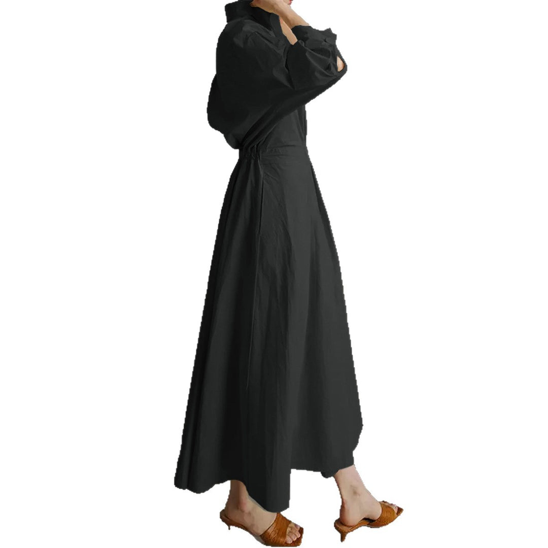 Women's tailored shirt dress with boxy collar, mid-length sleeves, side pockets, and flared pleated skirt Mune Fashion