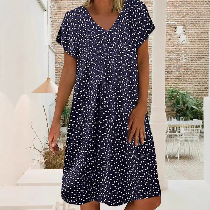 Ladies nan locker falling V-neck short dress with A-line cut, cap sleeves and all-over heart print Mune Fashion