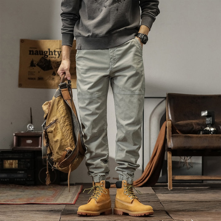 Men's tapered cargo pants in jogger style with knee seam details, drawstring & elastic cuffs