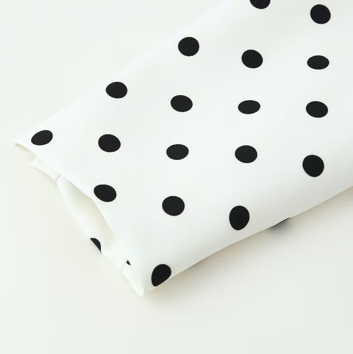 Women nan tailored short jacket with round neckline, contrast piping and polka dot pattern Mune Fashion