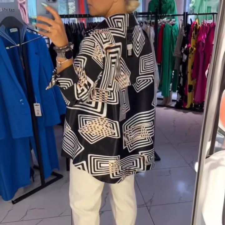 Women’s loose silk-look blouse with graphic square print, asymmetrical hem and mother-of-pearl button placket Mune Fashion
