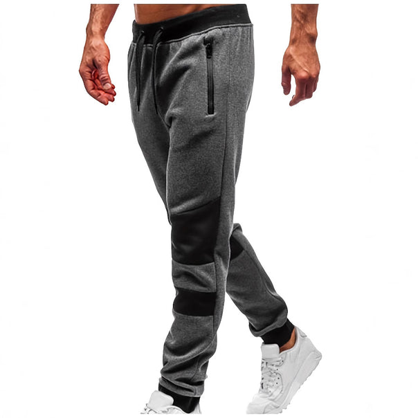 Men's slim-fit jogging pants with zip pockets, elastic comfort waistband, and reinforced knee panels Mune Fashion