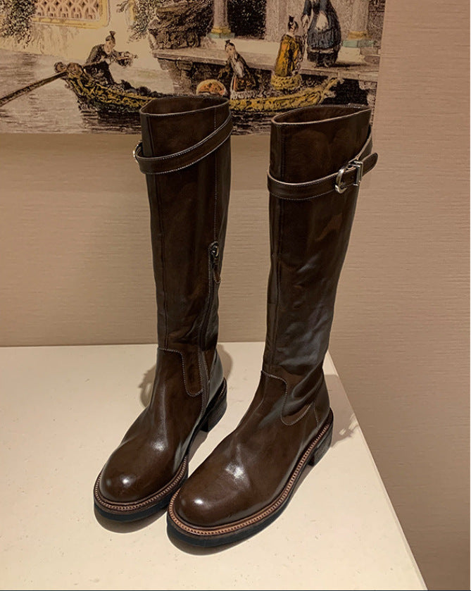 Ladies knee-high leather boots with flat profile sole and decorative strap Mune Fashion