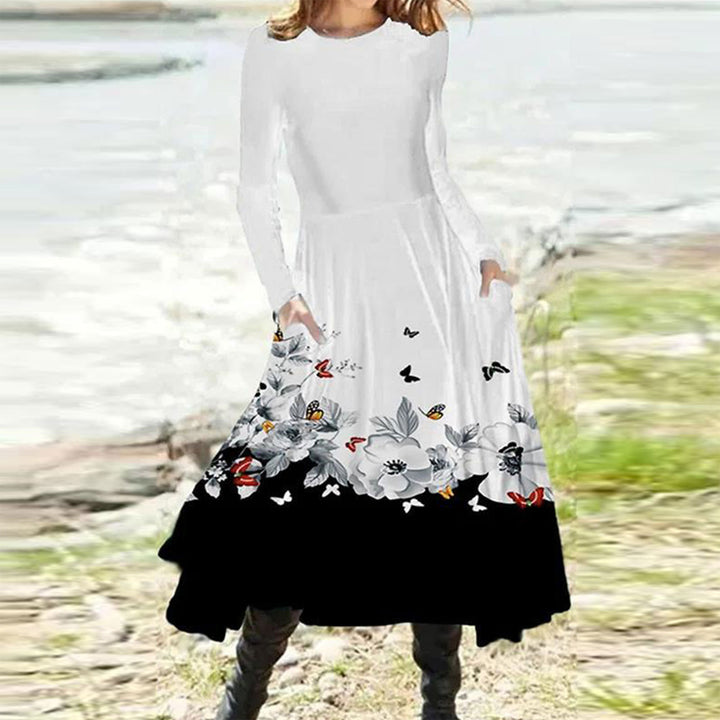 Women's flowing maxi dress with tie-dye circle pattern, round neckline, waist seam, and side pockets Mune Fashion