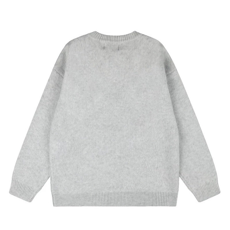 Ladies oversized knit sweater with round neck, appliqués, and vintage letter patches Mune Fashion