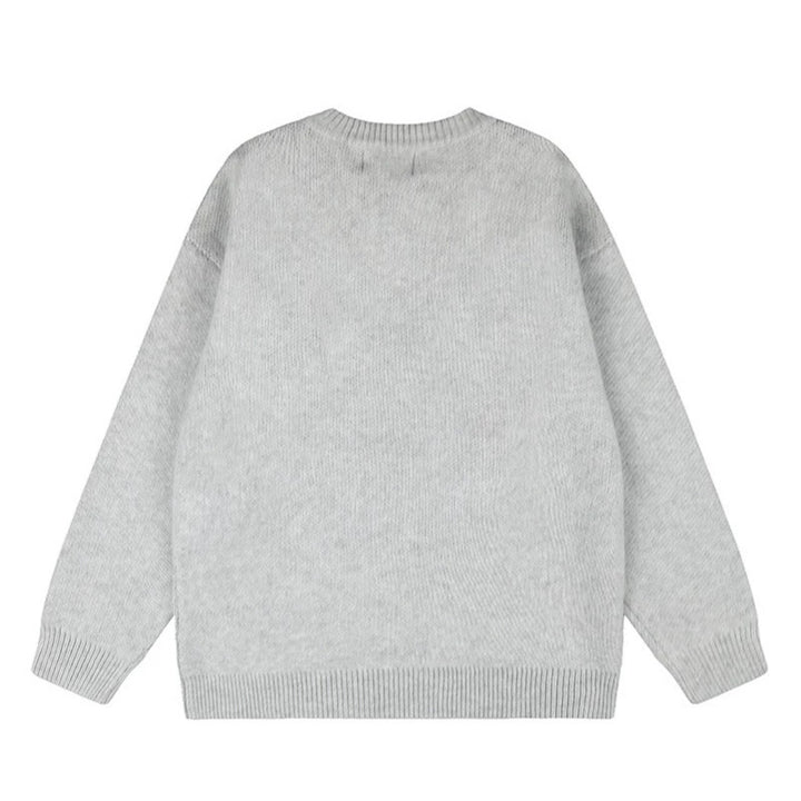 Ladies oversized knit sweater with round neck, appliqués, and vintage letter patches Mune Fashion