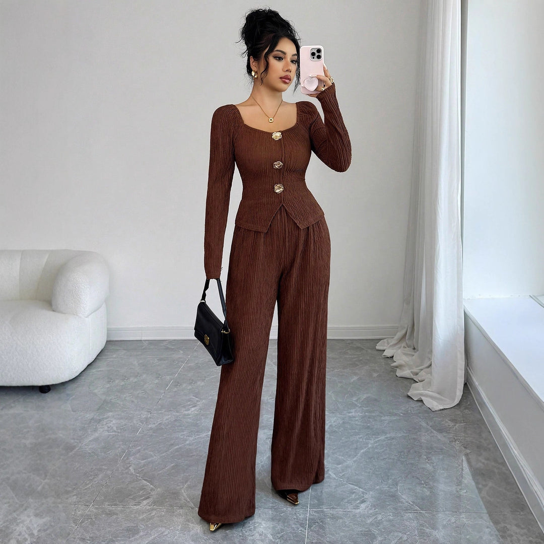 Women's tailored blouse and pants set made of crinkle pleats with puff sleeves and decorative buttons Mune Fashion