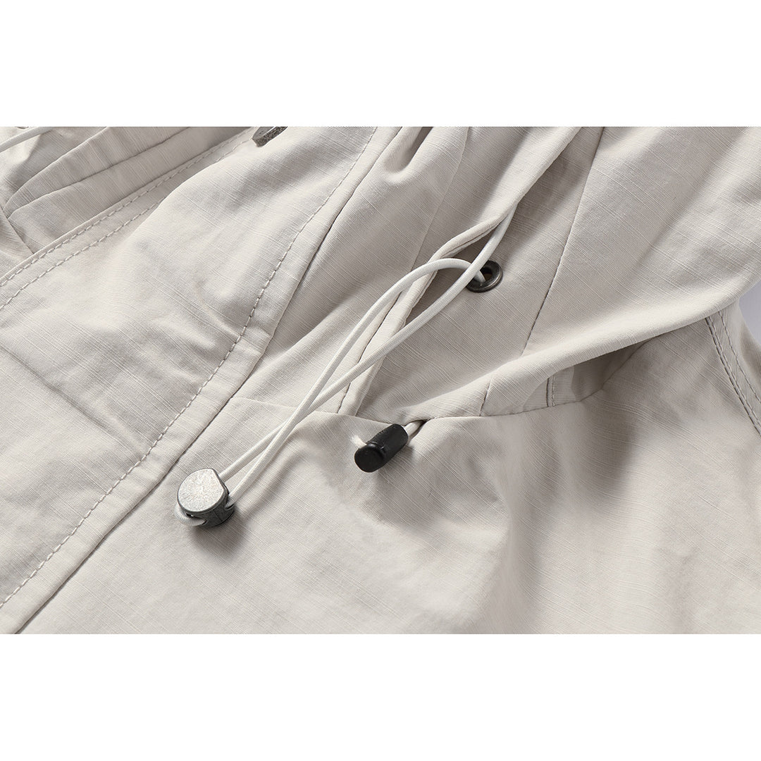 Unisex Light windproof hooded jacket in boxy cut with drawstring and concealed front Mune Fashion