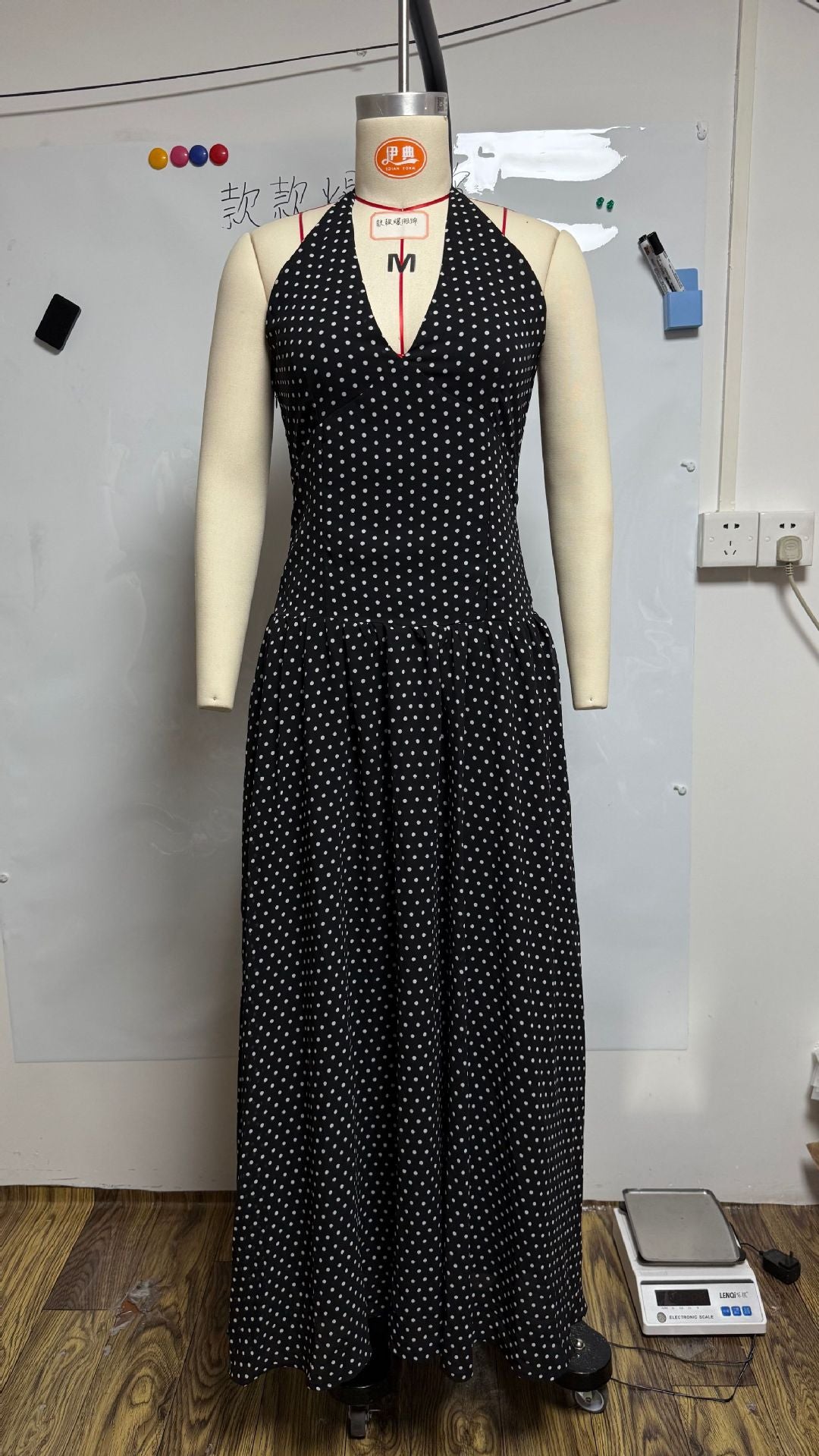 Ladies long halter dress with deep V-neck, tailored empire seam and flared layered skirt Mune Fashion