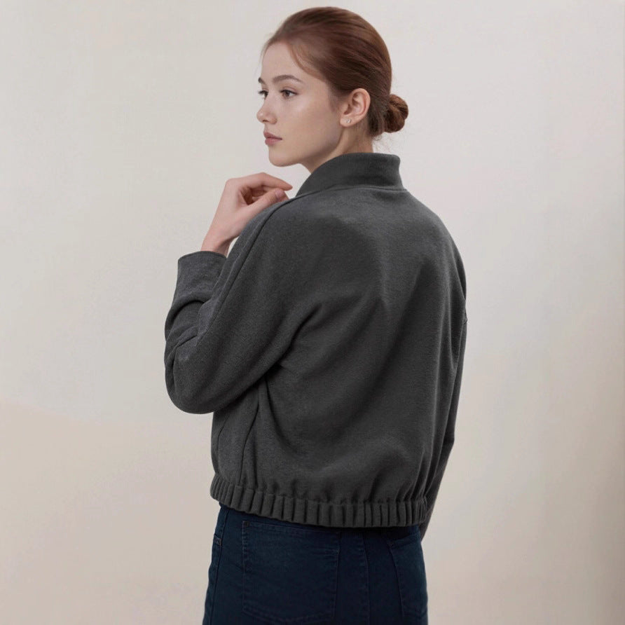 Women's cozy fleece bomber jacket with stand-up collar, ribbed hem, and snap button placket Mune Fashion