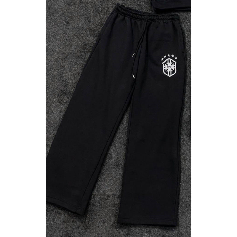 Women's loose jogging pants with elastic waistband, drawstring, and embroidered emblem Mune Fashion