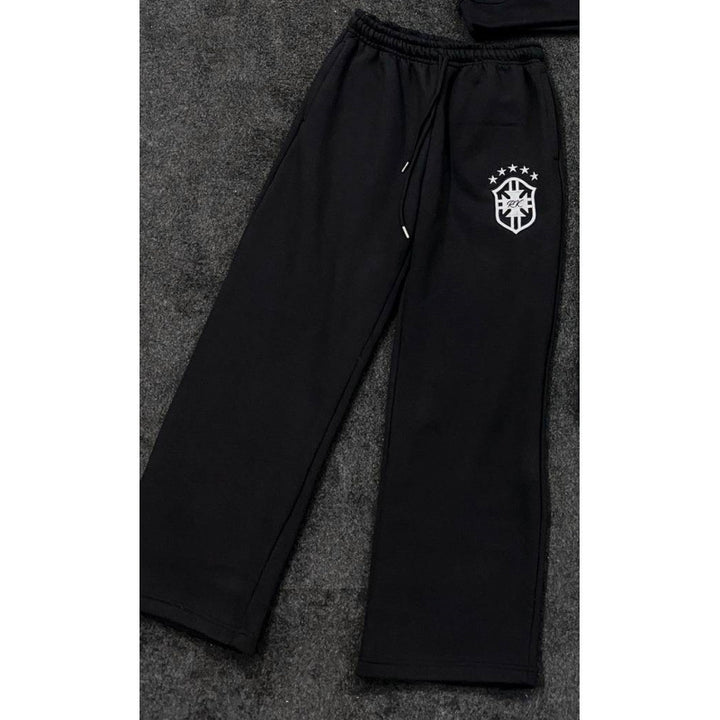 Women's loose jogging pants with elastic waistband, drawstring, and embroidered emblem Mune Fashion