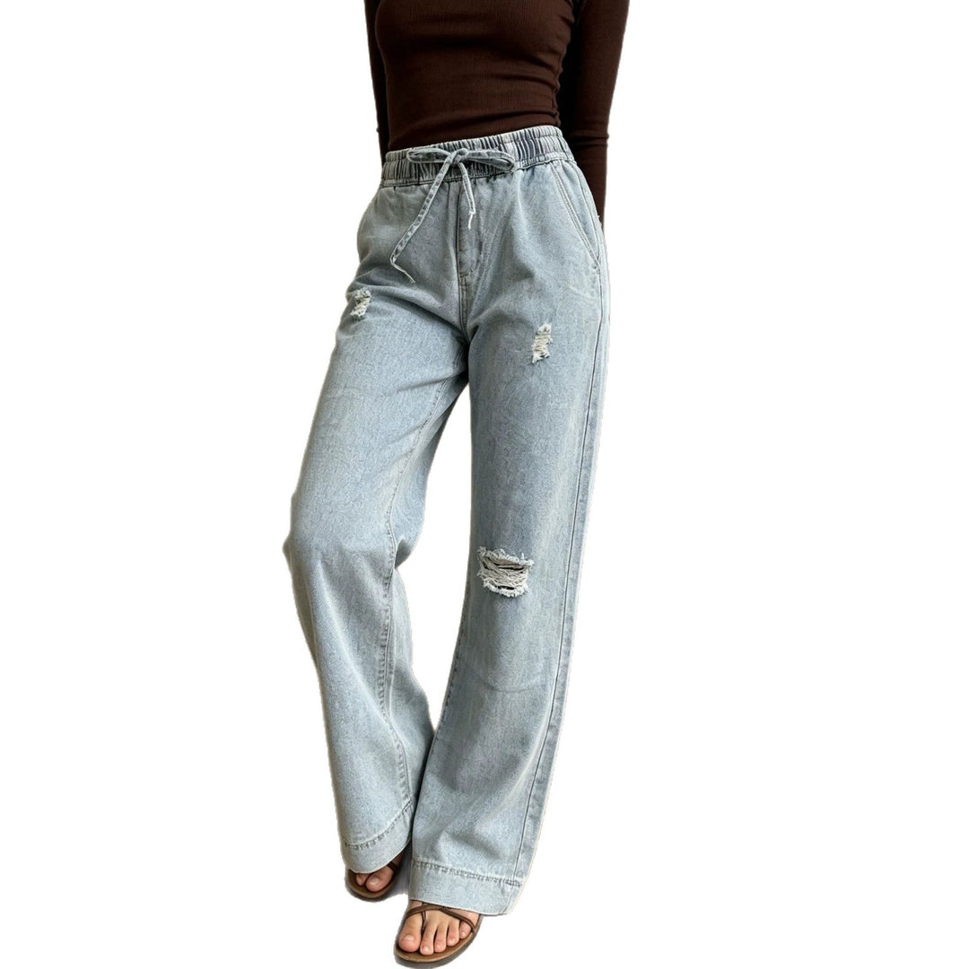 Women's wide denim pants with elastic drawstring waistband, used effects and relaxed fit Mune Fashion