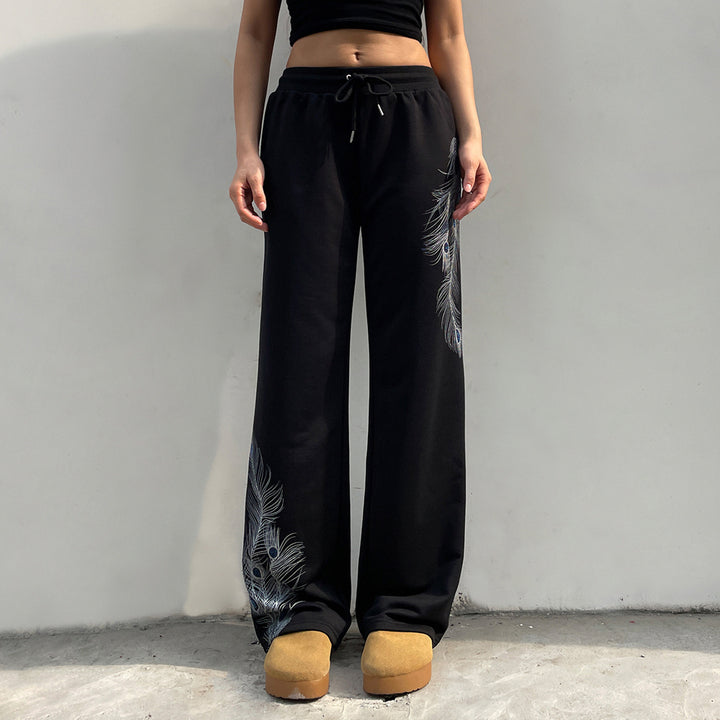 Ladies' wide lounge pants with drawstring, high comfort waistband and peacock feather print Mune Fashion