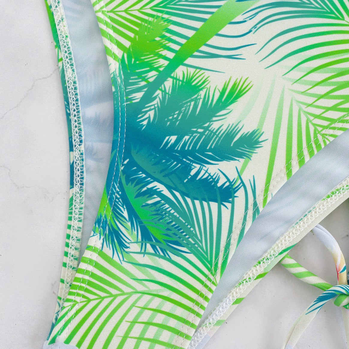 Ladies bikini set with elegant wrap skirt and tropical design Mune Fashion