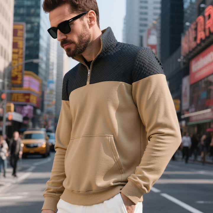Men's color block half zip sweatshirt with quilted chest area, kangaroo pocket, and elastic cuffs Mune Fashion
