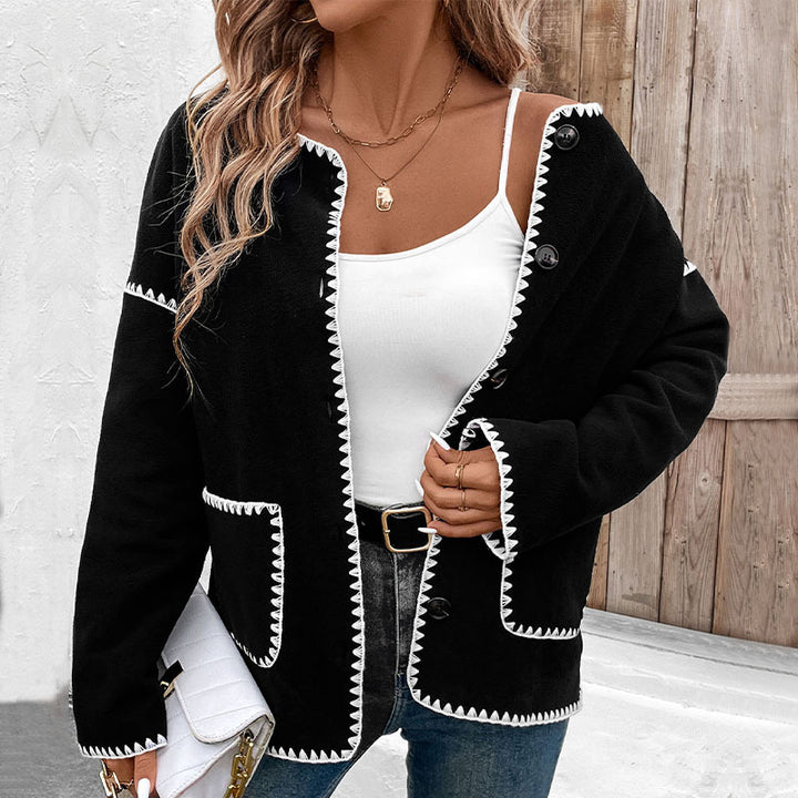 Women's oversized cardigan with contrasting decorative seams, patch pockets and button placket Mune Fashion