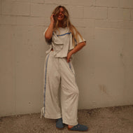 Ladies two-piece leisure ensemble with boxy ruffle top and wide cord pants with side decorative stripe Mune Fashion